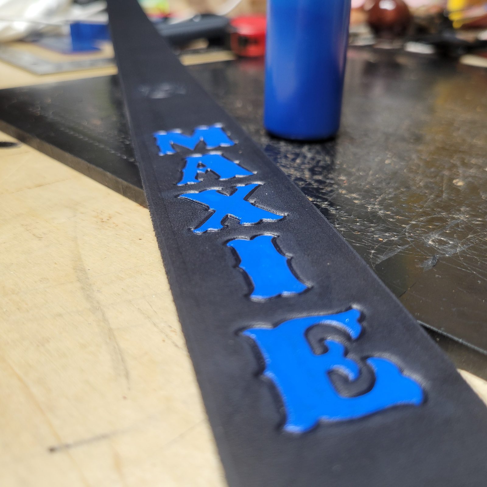 A name struck into the leather and filled with paint