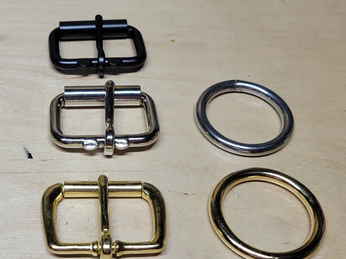 Roller buckles in black, stainless and solid brass, with stainless and brass rings